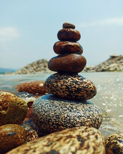 Minimalist Zen stones stack with soft amber backlight